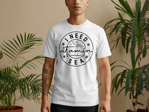 White t-shirt with "I Need Vitamin Sea" text and beach graphic.