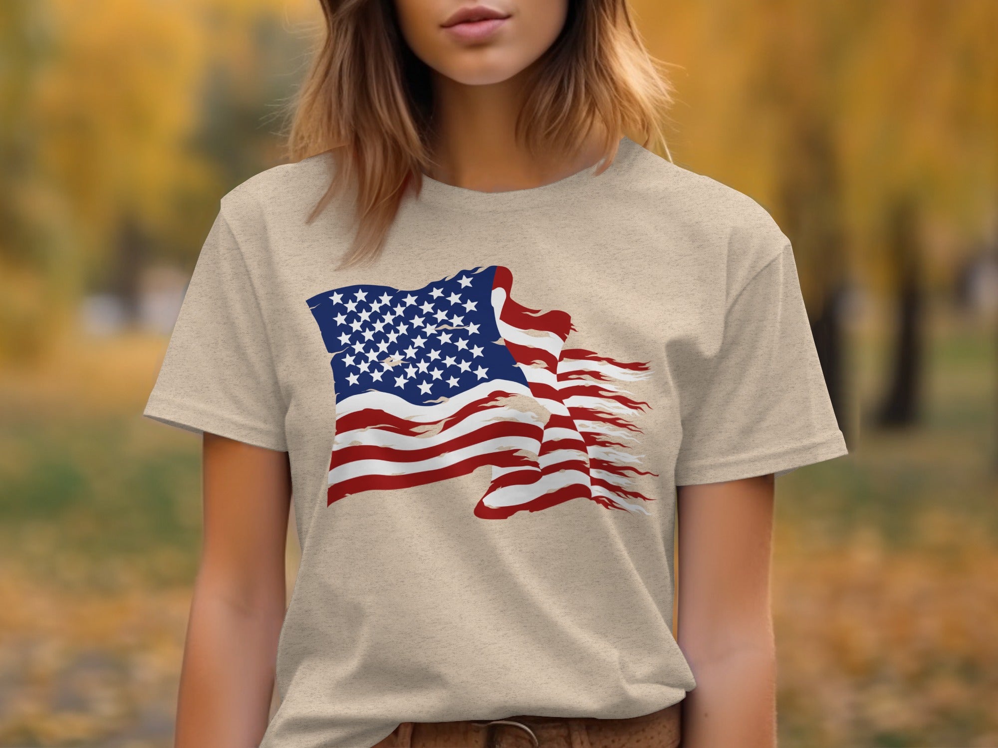 T-shirt with distressed American flag graphic on beige fabric.