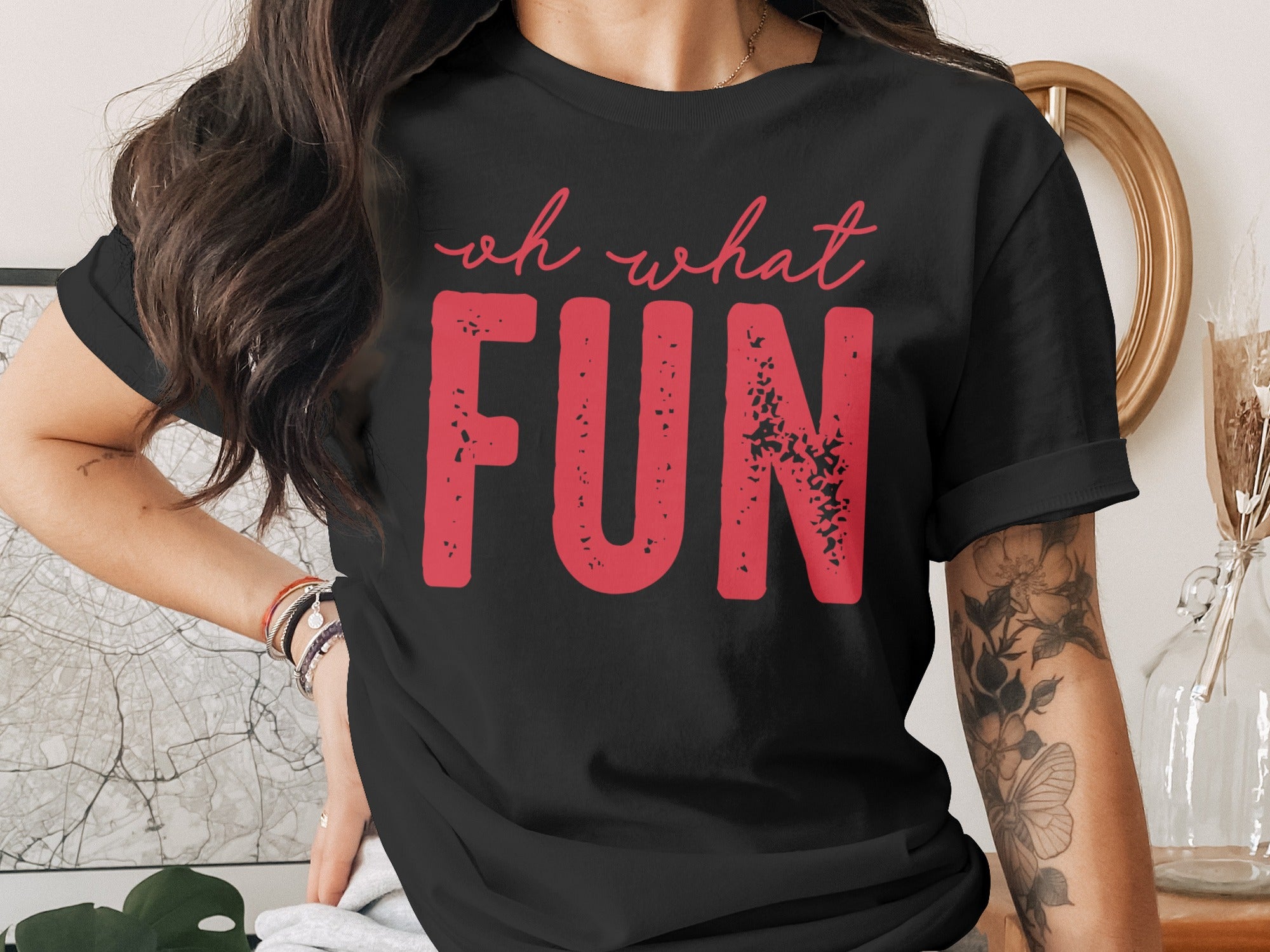 Black t-shirt with red text saying "oh what FUN"