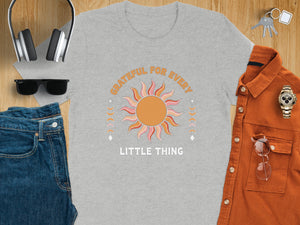 Grey t-shirt with "GRATEFUL FOR EVERY LITTLE THING" and a sun graphic.