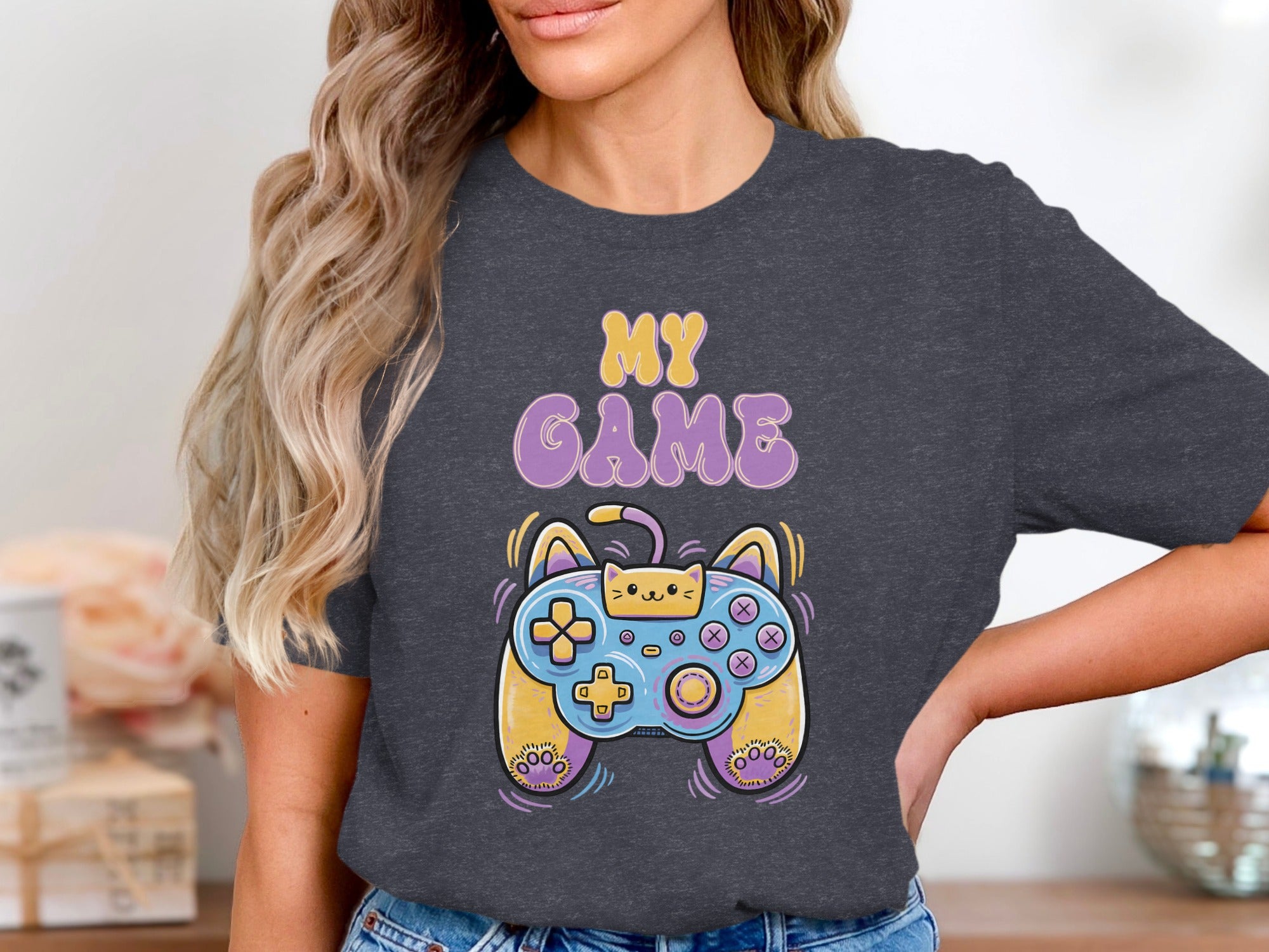 "My Game" text above a cat-themed video game controller on a dark gray t-shirt.