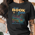 Black t-shirt with "Seaside BOOK Lover" text, books, shells, and a bird.