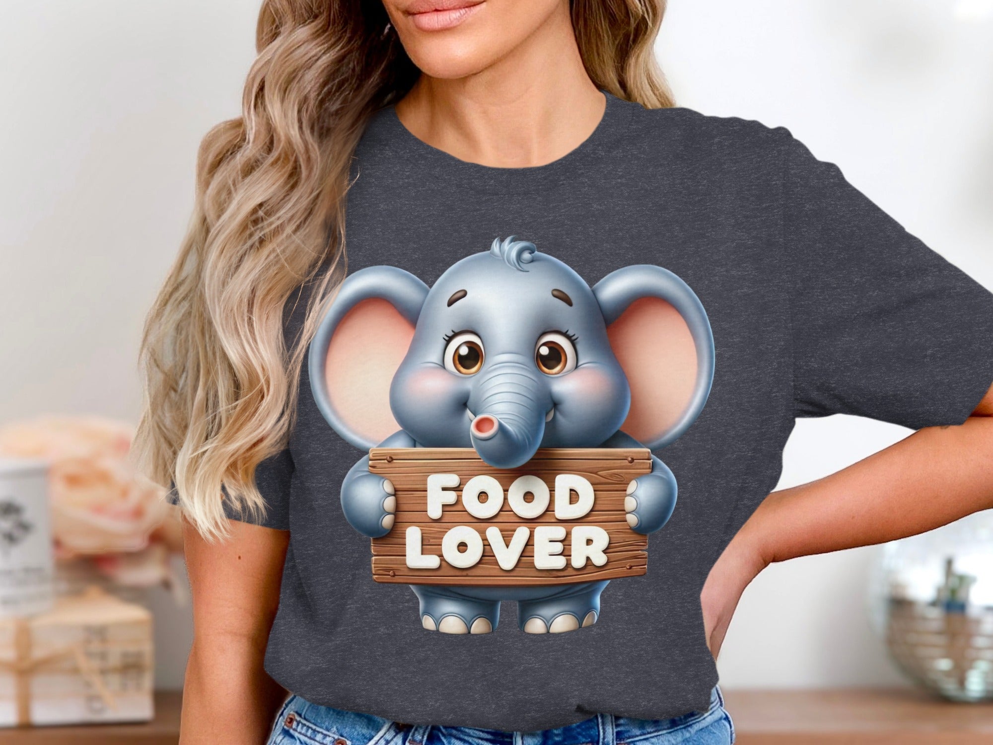 Cute cartoon elephant holds wooden sign with "FOOD LOVER" text.