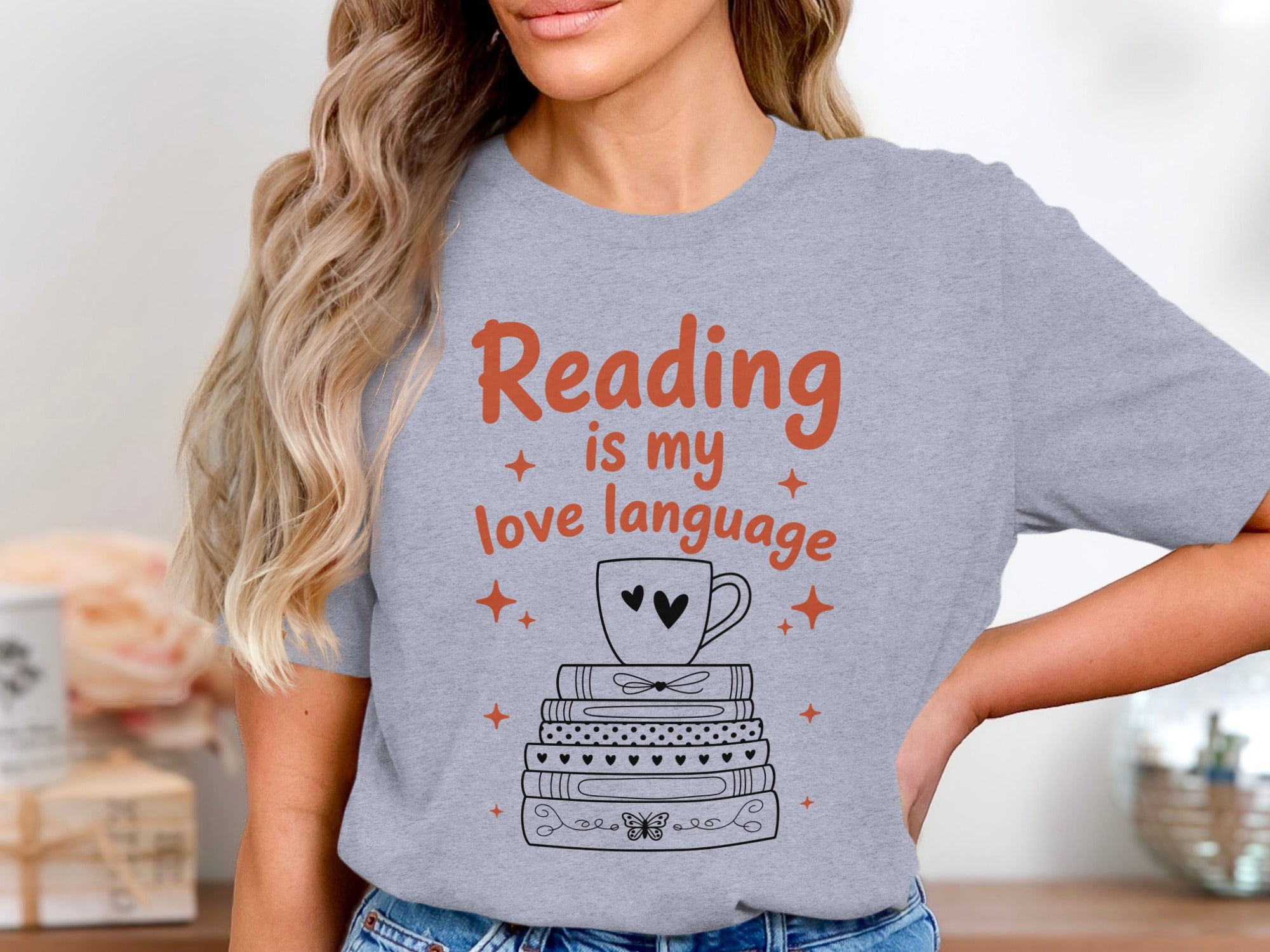 Grey t-shirt with "Reading is my love language" and stack of books design.