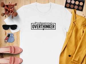 White t-shirt with black text reading "Professional Overthinker" and a small heart.