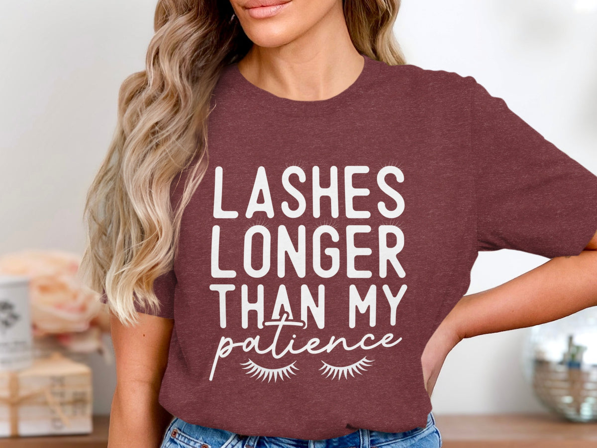 Burgundy t-shirt with "Lashes Longer Than My Patience" text and eyelashes graphic.