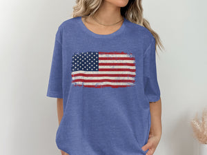 Blue t-shirt with distressed American flag graphic on the chest.