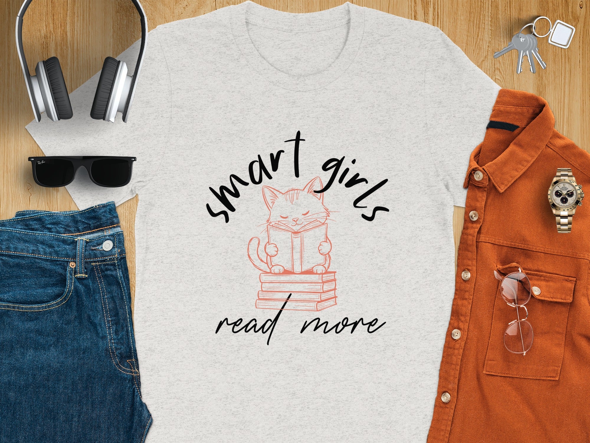 Light grey t-shirt with pink cat graphic reading "smart girls read more."