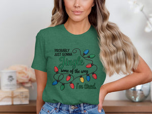 Green t-shirt with Christmas lights graphic and text: "PROBABLY JUST GONNA Jingle some of the way. I'm tired."