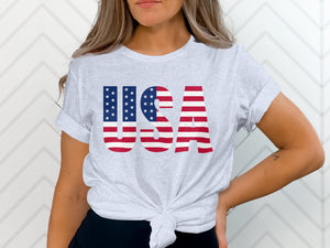 Light grey t-shirt with bold "USA" text in American flag design.