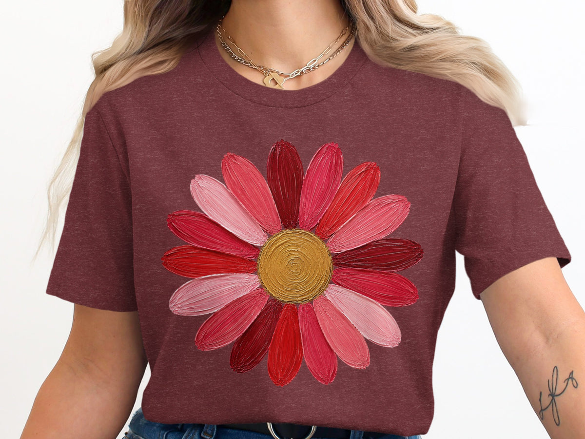 Maroon t-shirt with a colorful abstract flower graphic.