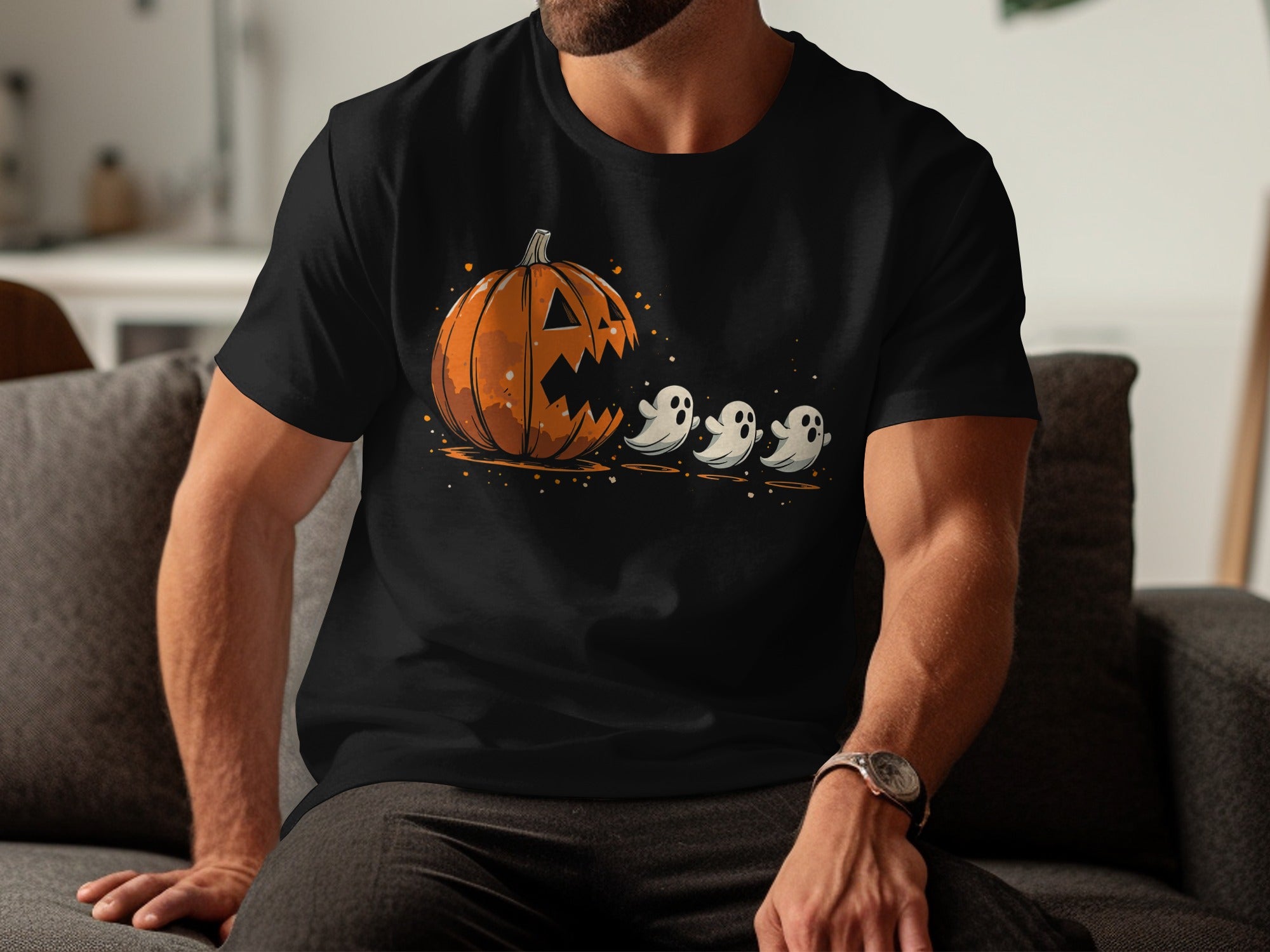 Black t-shirt with a jack-o'-lantern and three ghosts graphic illustration.