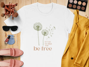 White t-shirt with dandelions and "Let Go. Fly High. And Be Free." text.