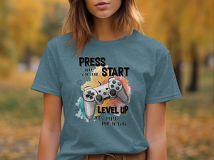 T-shirt with "Press Start," "Level Up," and gaming controller graphic.