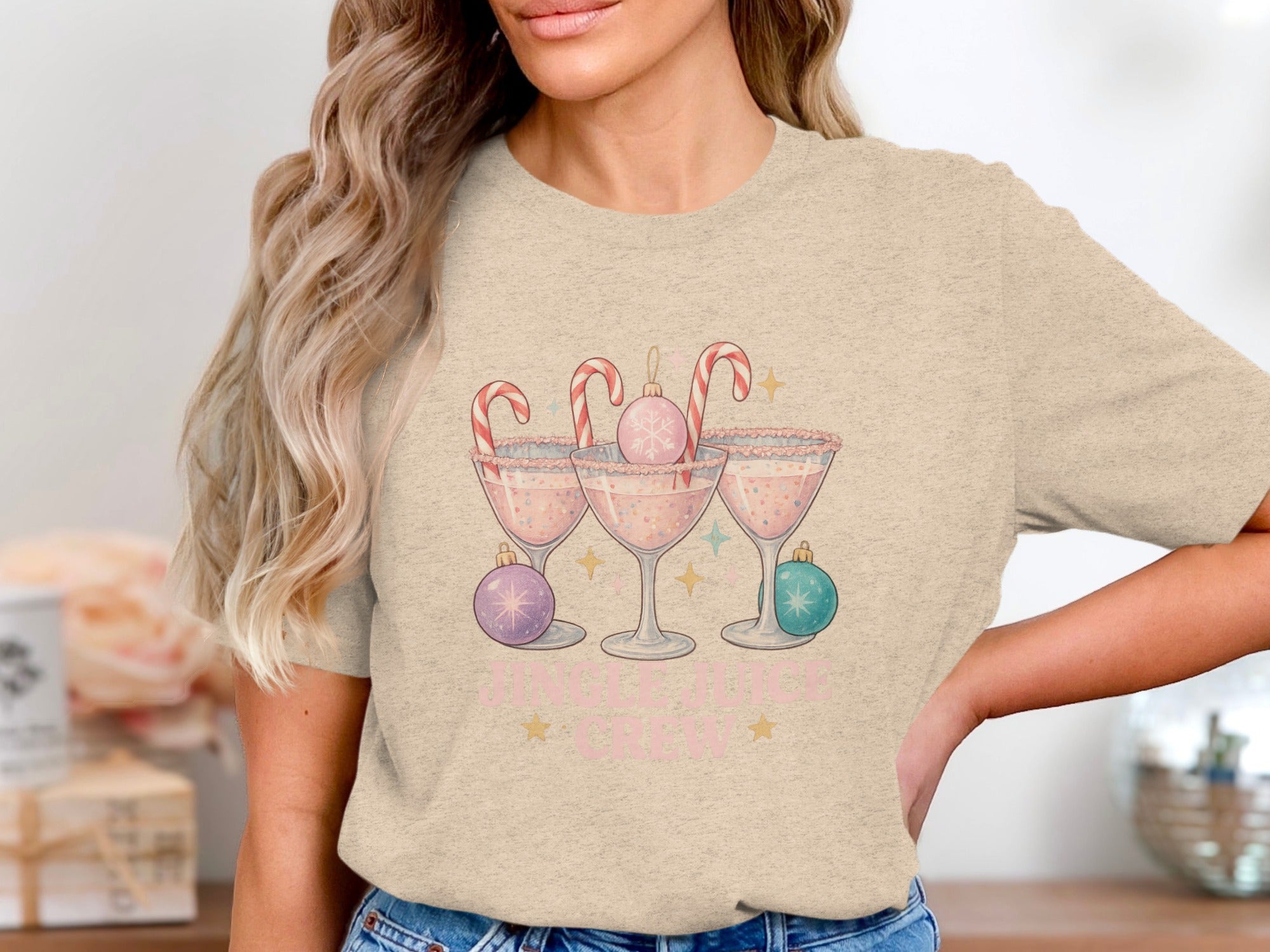 T-shirt graphic with three cocktail glasses, candy canes, ornaments, and "Jingle Juice Crew" text.