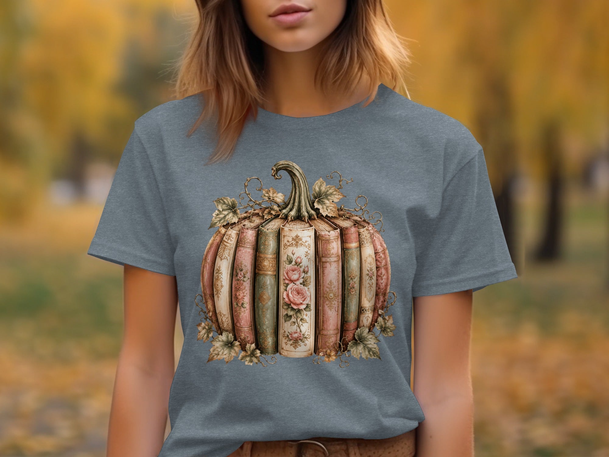 Gray t-shirt with watercolor book pumpkin graphic and autumn leaves.