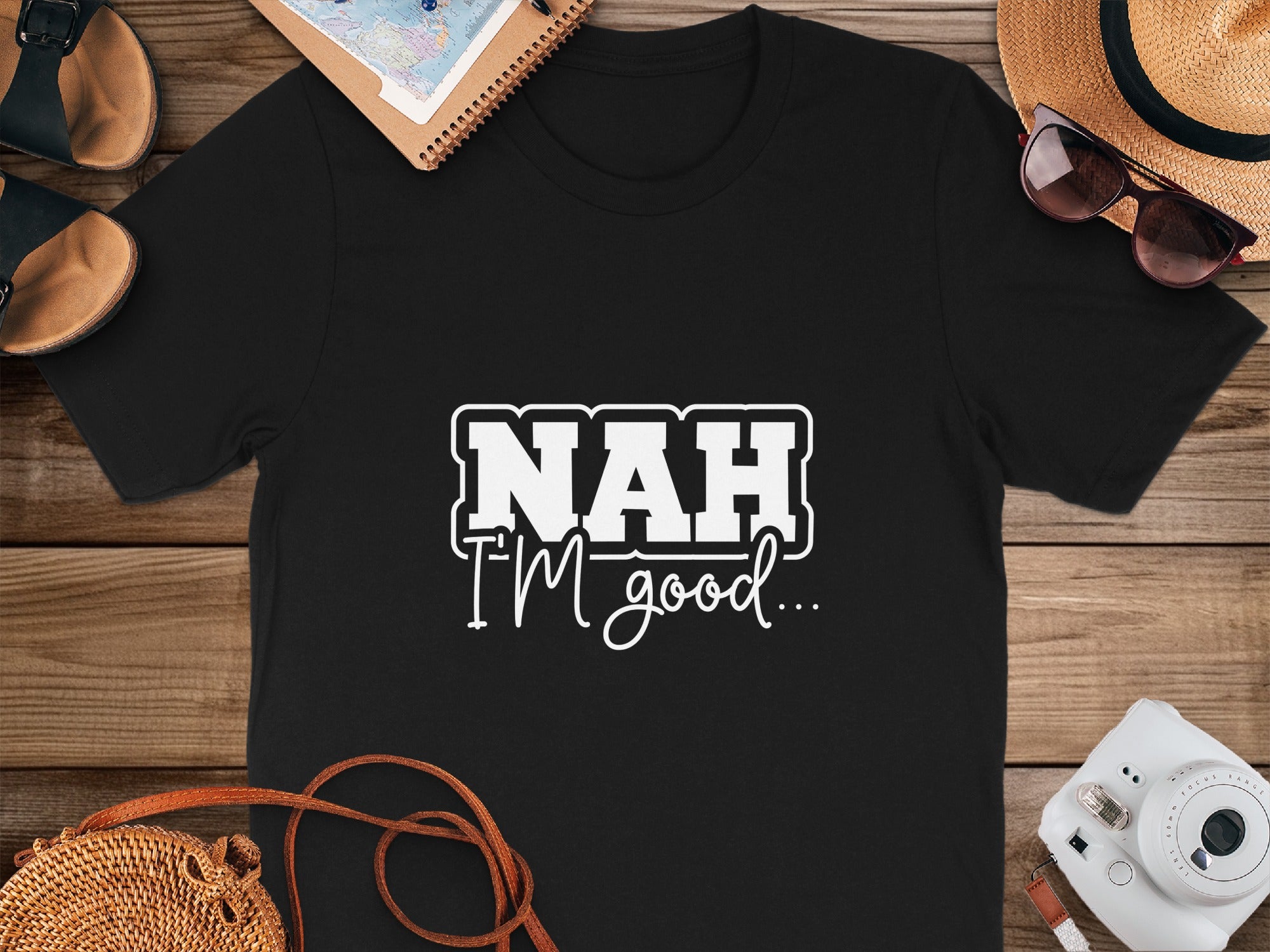Black t-shirt with white text "NAH I'M good..."