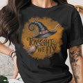 Black t-shirt with witch hat and broom graphic reading "TONIGHT WE FLY."