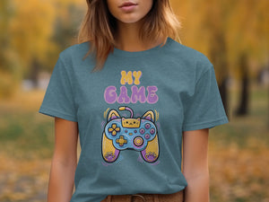 Teal t-shirt with "MY GAME" text and a cat-themed video game controller graphic.
