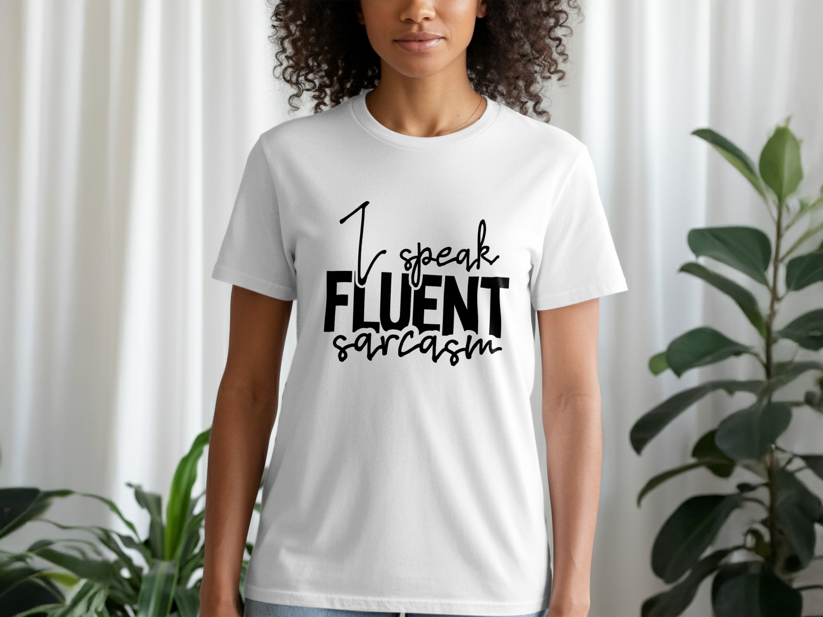 White t-shirt with black text that reads "I speak FLUENT sarcasm".