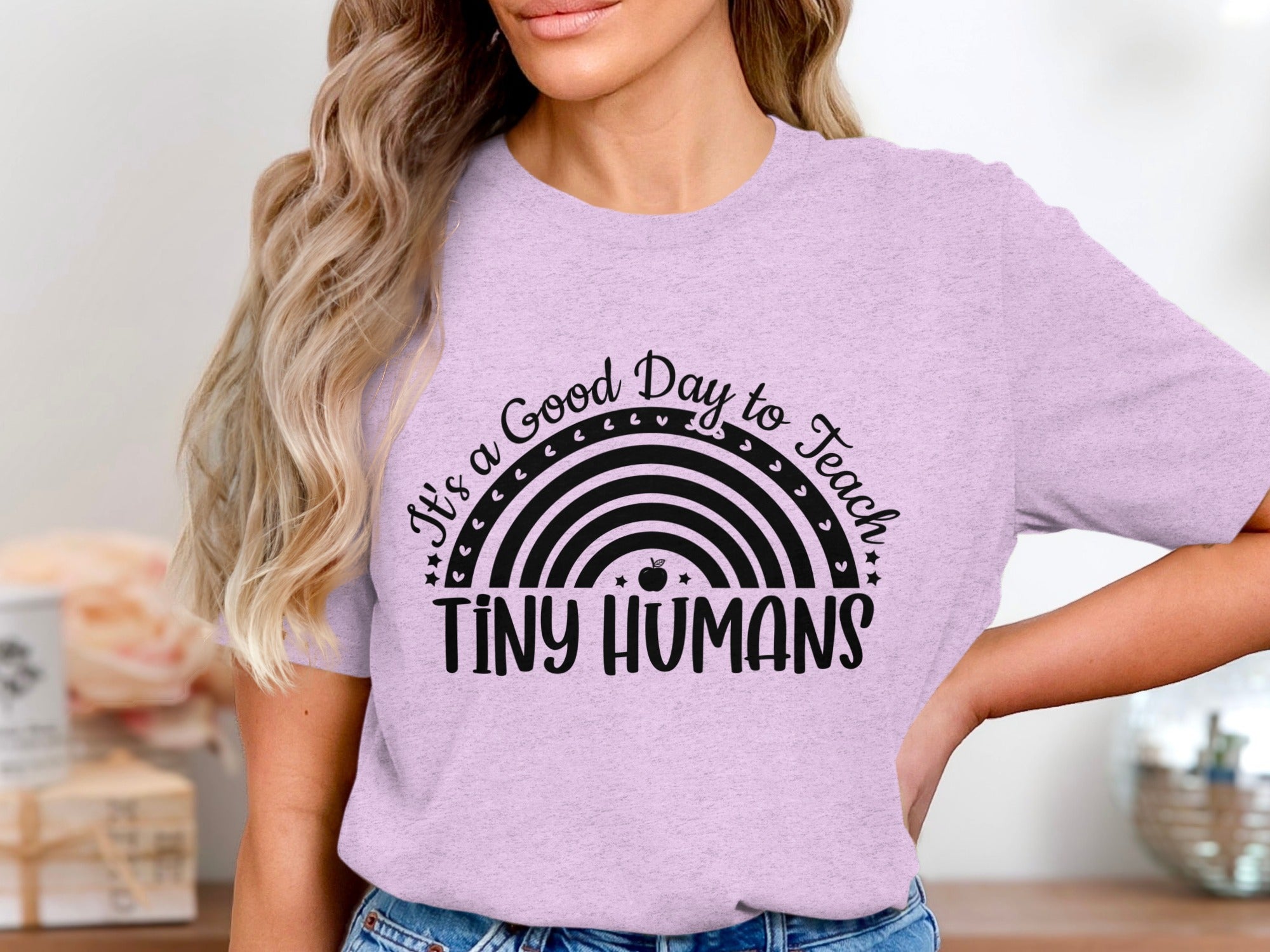 Light purple t-shirt with "It's a Good Day to Teach Tiny Humans" and rainbow graphic.