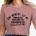Dusty rose t-shirt with "One moment, let me overthink this" text.