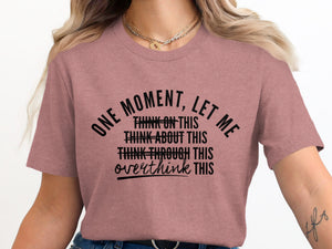 Dusty rose t-shirt with "One moment, let me overthink this" text.