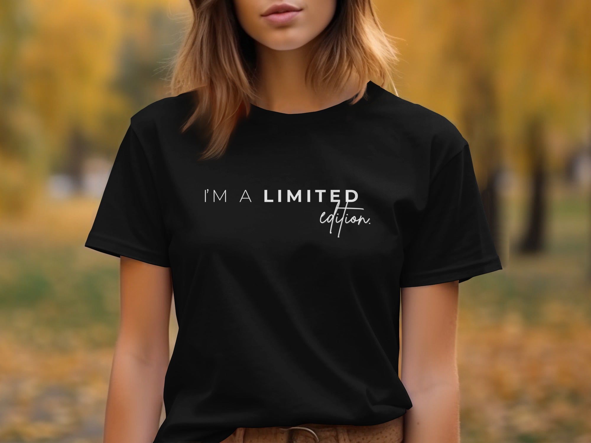 Black T-shirt with "I'M A LIMITED edition." text in white script.