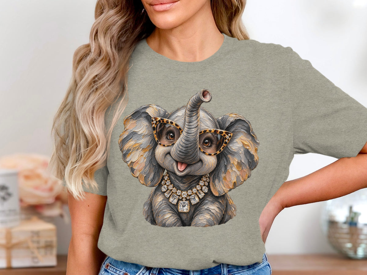 T-shirt with a graphic of a cute elephant wearing leopard glasses and a diamond necklace.