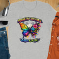 Gray t-shirt with butterfly graphic and text "BROKEN CRAYONS STILL COLOR"