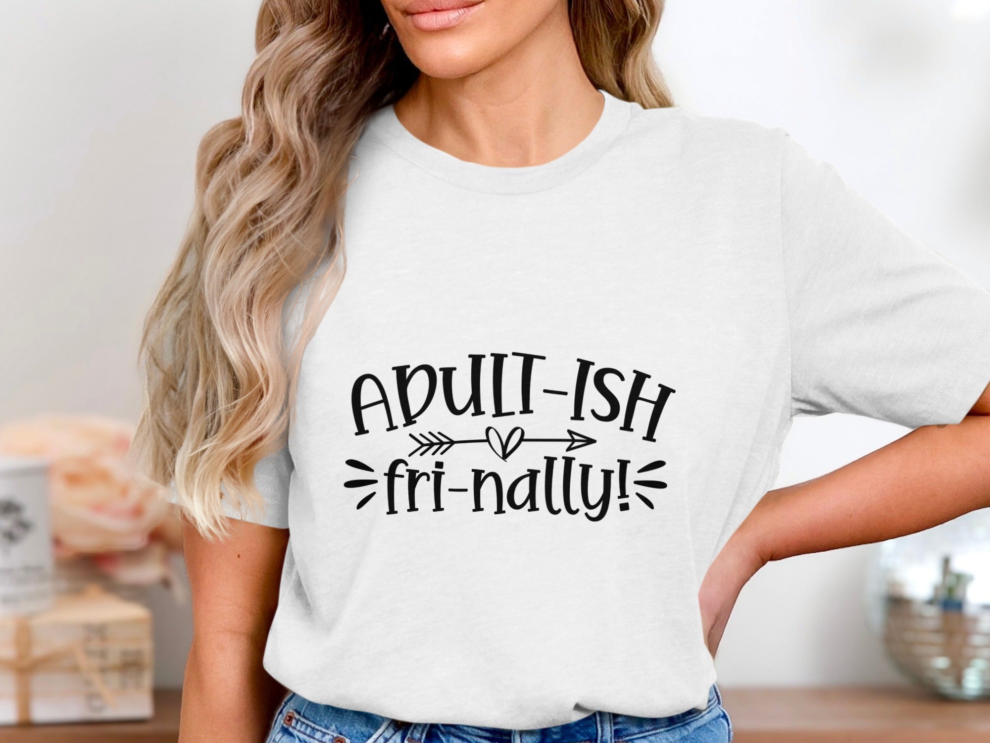 White t-shirt with black text that reads "ADULT-ISH fri-nally!"