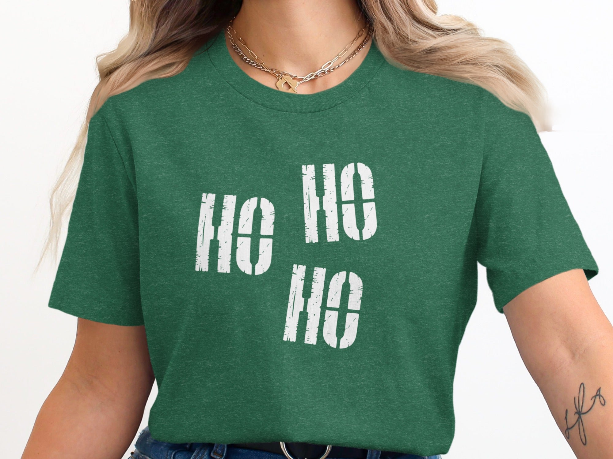 Green t-shirt with white stencil-style "HO HO HO" text across chest.