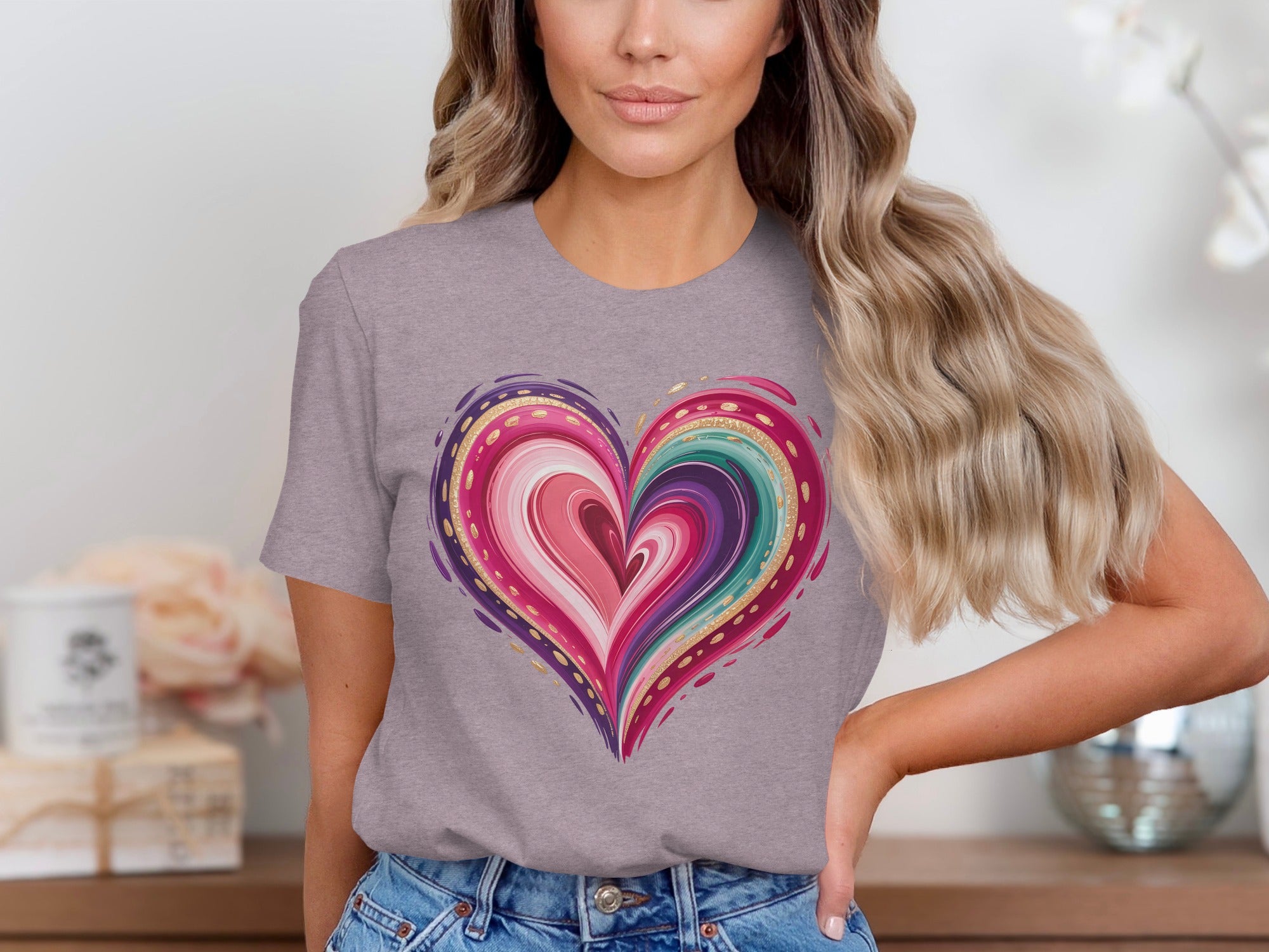 Grey t-shirt with a colorful heart design featuring pinks, purples, and teal.