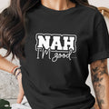 Black t-shirt with white text "NAH I'M good..."