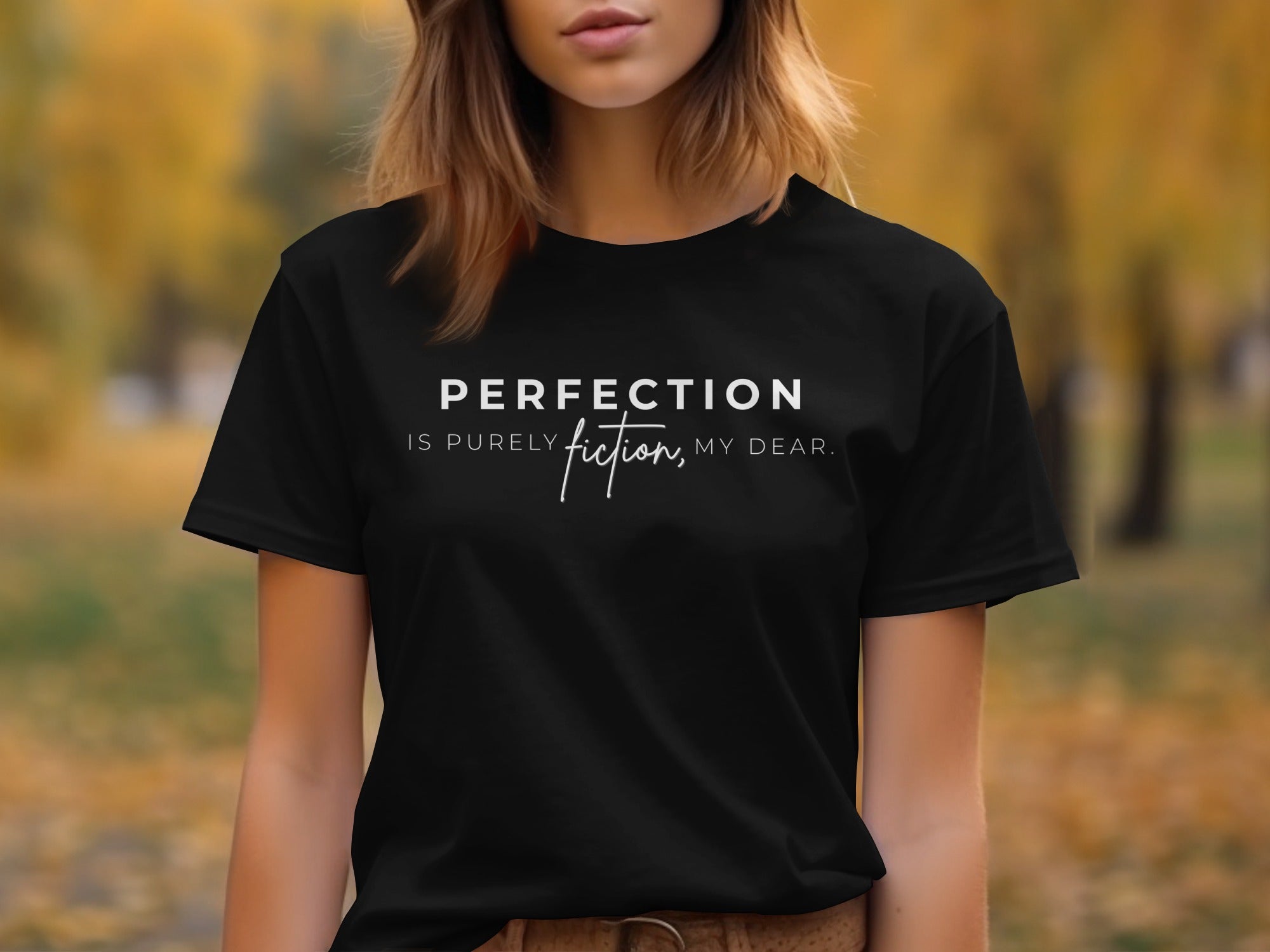Black t-shirt with text "PERFECTION IS PURELY fiction, MY DEAR."