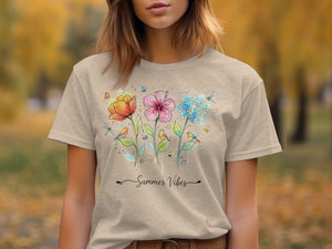 Tan t-shirt featuring watercolor flowers, birds, butterflies, and "Summer Vibes" text.