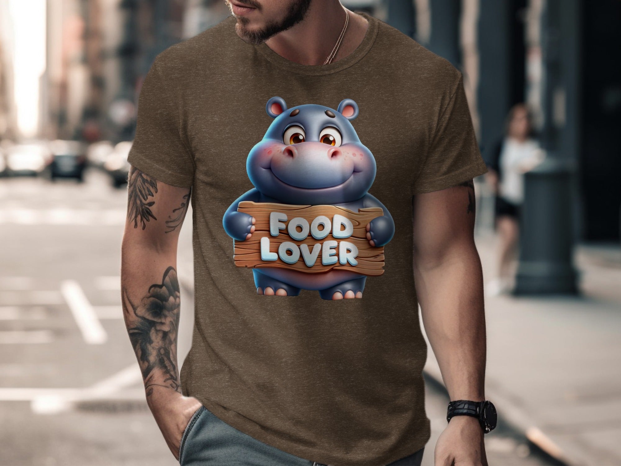 Brown t-shirt with a cartoon hippo holding a "FOOD LOVER" sign.