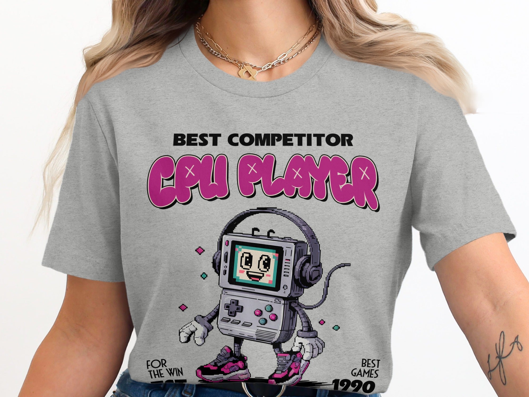 Grey t-shirt with "BEST COMPETITOR CPU PLAYER" and a pixelated game console character.