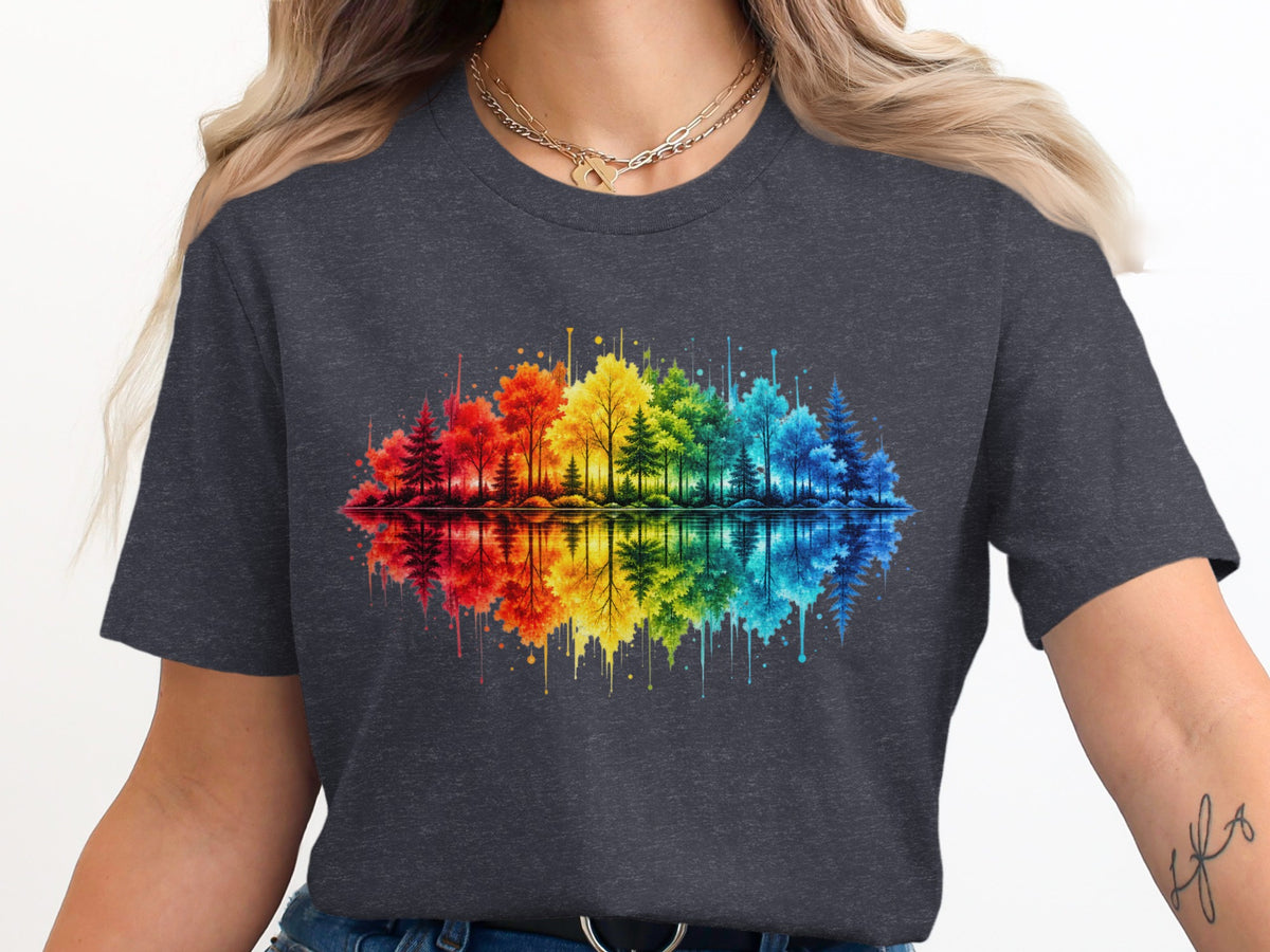 Watercolor rainbow forest with reflection on water displayed on a dark gray t-shirt.