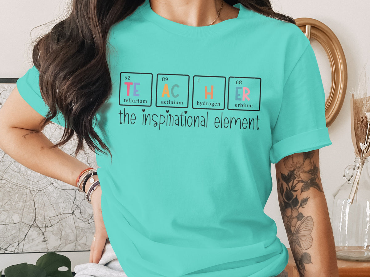 Turquoise t-shirt with periodic table elements spelling TEACHER.