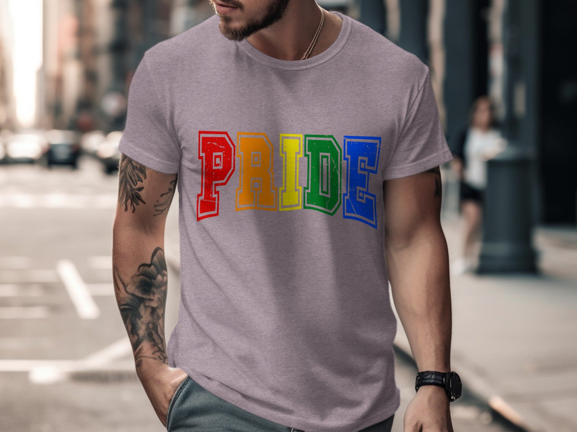 Grey t-shirt with rainbow "PRIDE" text in collegiate font.