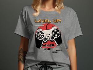 T-shirt with "LEVEL UP! Never Quit Press Start" text and video game controller graphic.