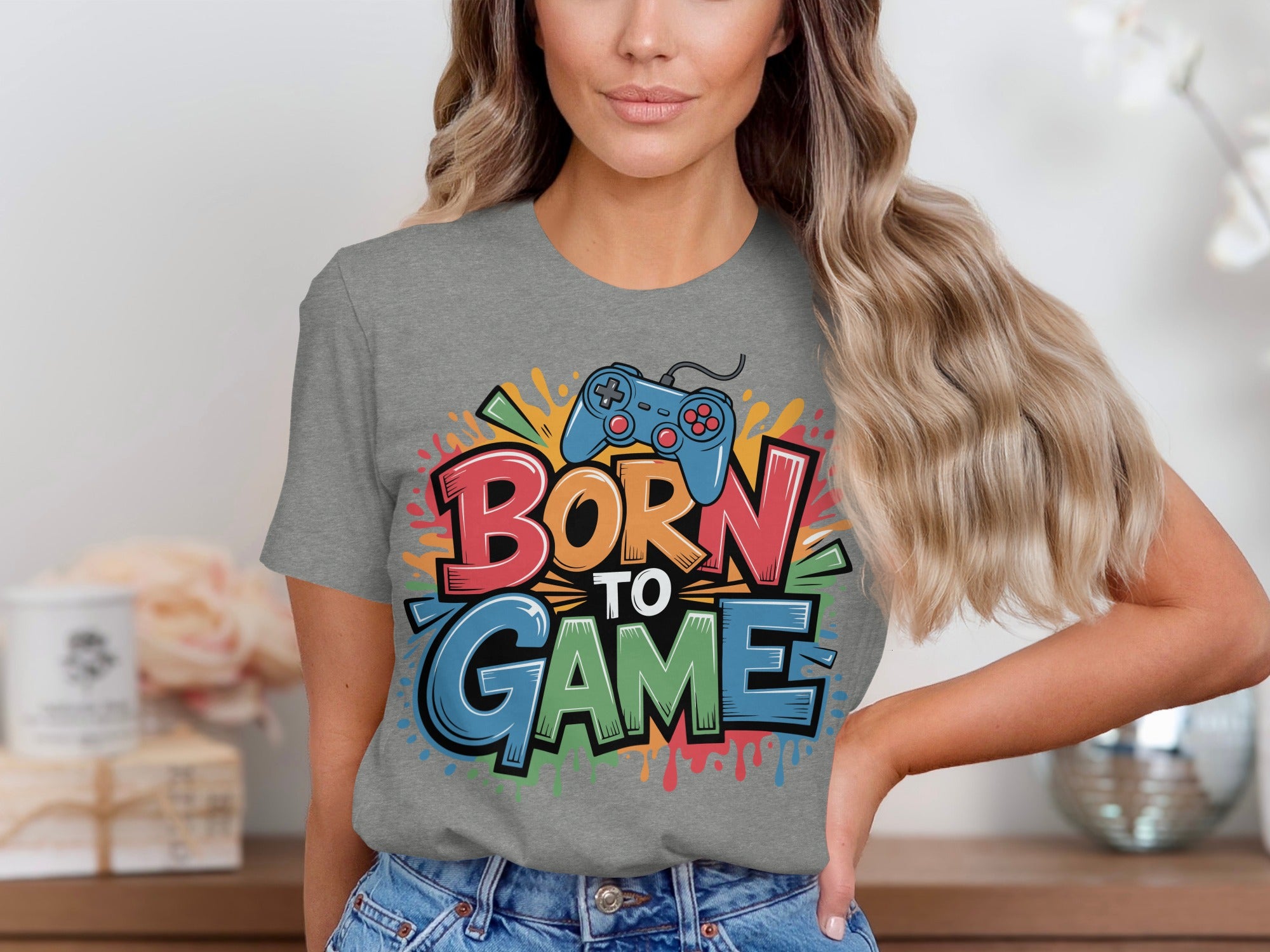 Grey t-shirt with colorful "BORN TO GAME" text and a blue video game controller.