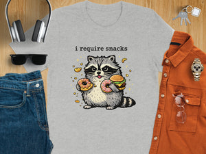 Grey t-shirt with a cartoon raccoon holding a burger and two donuts. Text reads "i require snacks."