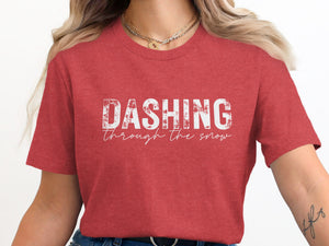 Red t-shirt with white distressed text "DASHING through the snow"