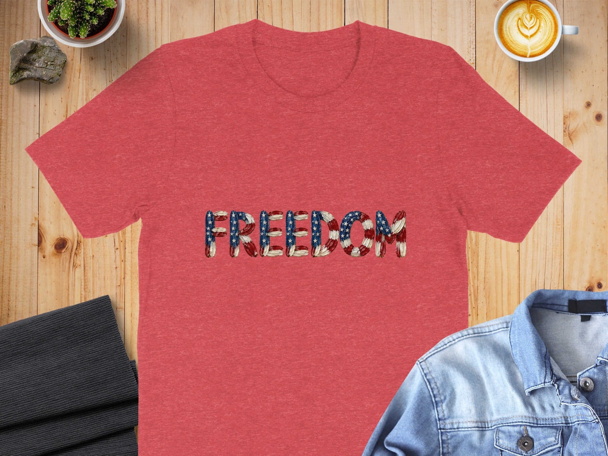 Red t-shirt with "FREEDOM" text in American flag design.