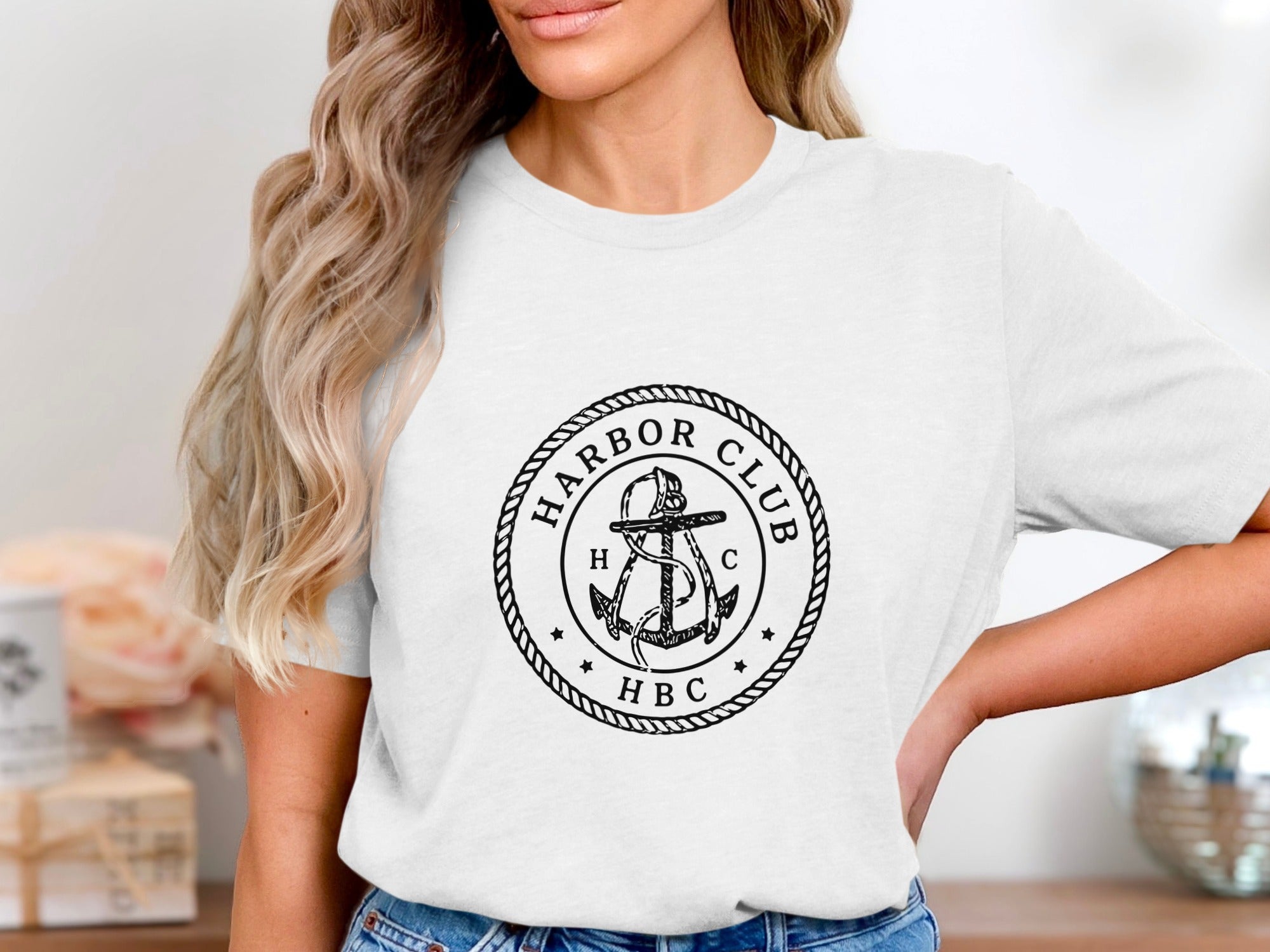 White t-shirt with black "Harbor Club HBC" logo featuring an anchor.