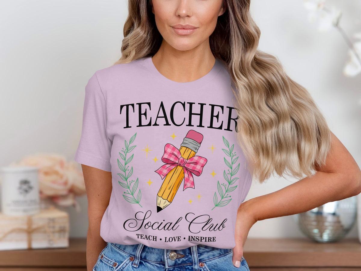 Lilac t-shirt with "TEACHER Social Club" and pencil graphic.