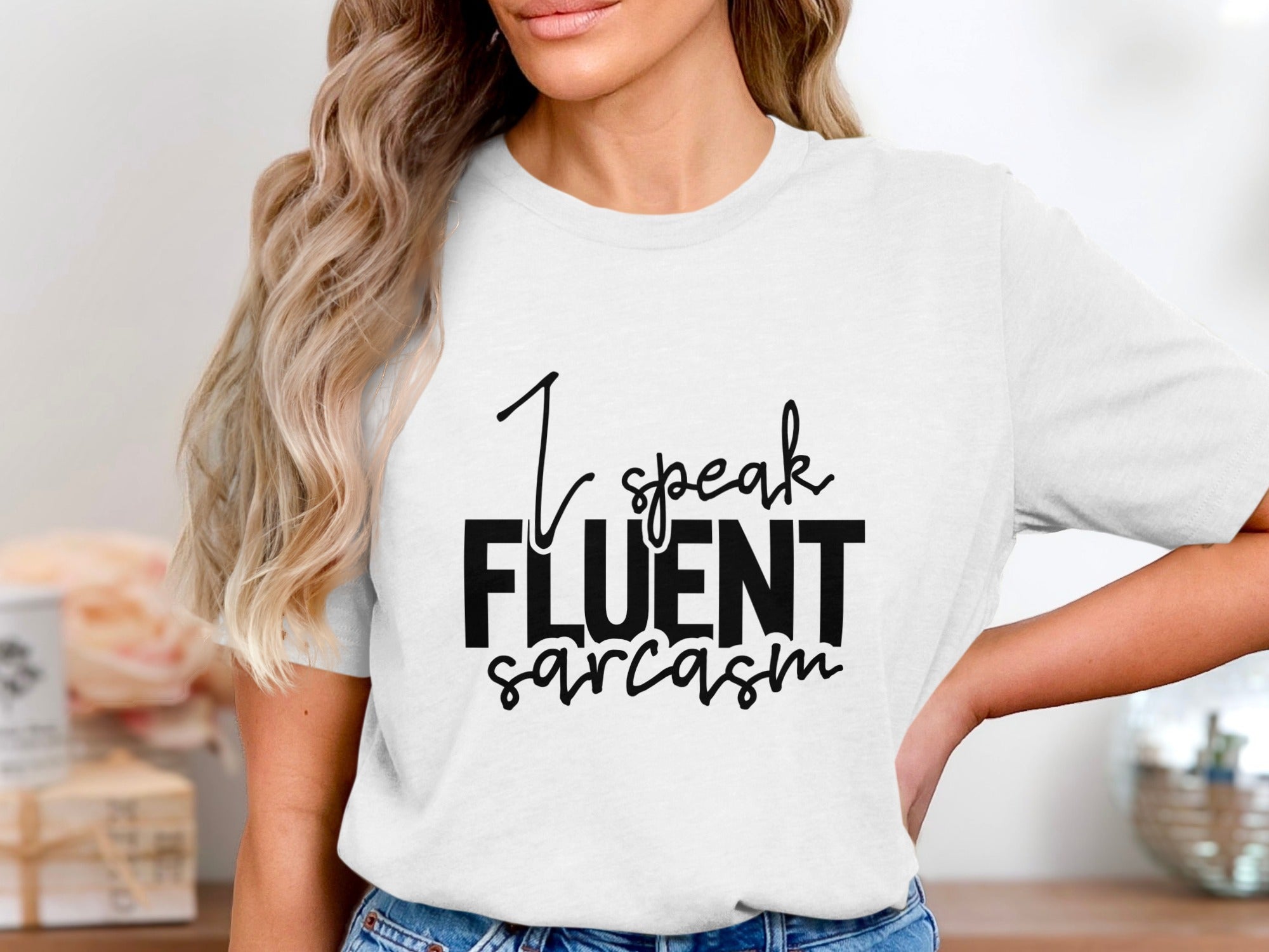 White t-shirt with black text reading "I speak FLUENT sarcasm".