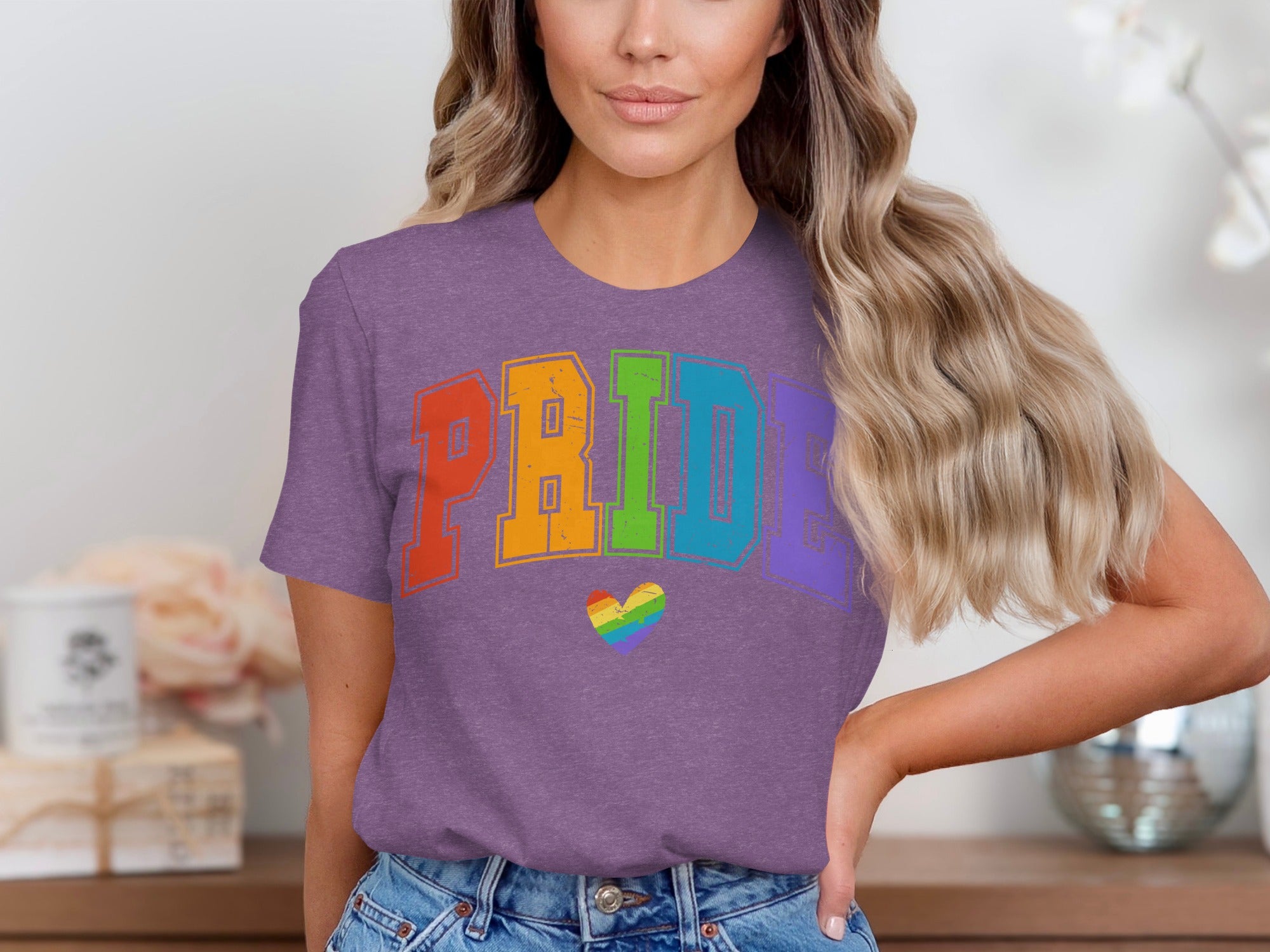 Purple t-shirt with "PRIDE" in rainbow varsity letters and a rainbow heart.